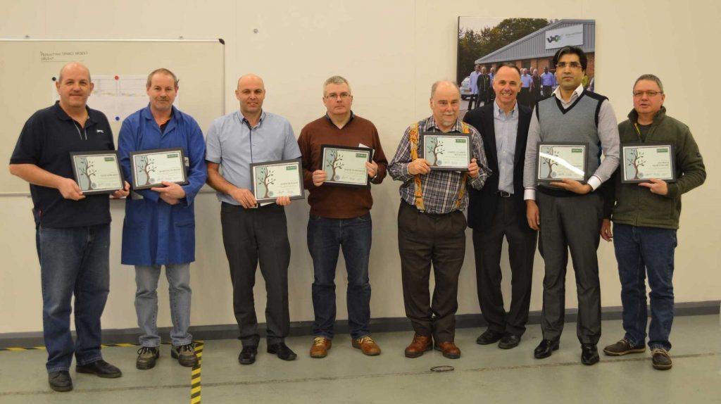 Pictured L to R: Nick Edwards (40 years); Martin Purser (20 years); John Wilson (25 years); Dave Turnbull (15 years); Chris Clarke-Williams (35 years); Shoaib Idrees (5 years); and Patrick Mortimore (10 years). Andrew Marcou, Crowley Company CFO (third from right), presented plaques and gifts during a recent visit.